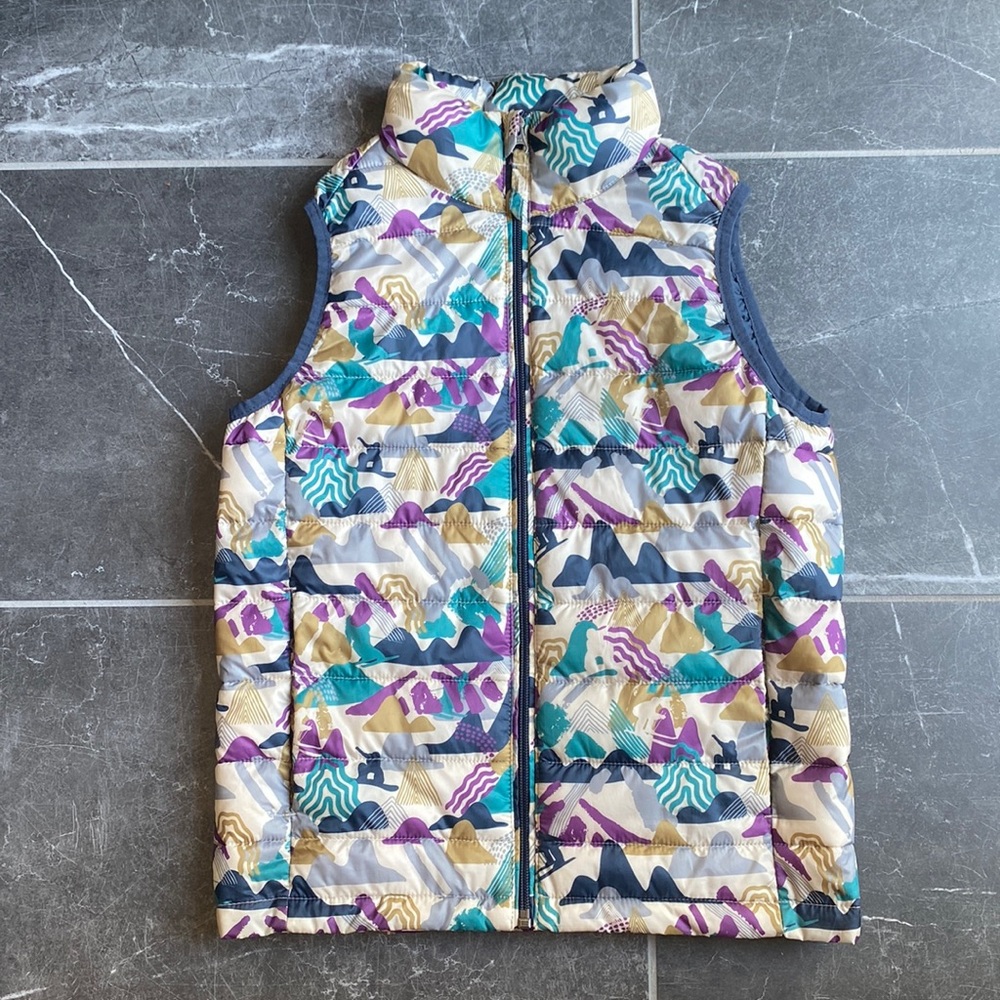 Youth medium puffer vest with snowboarders. Like new.